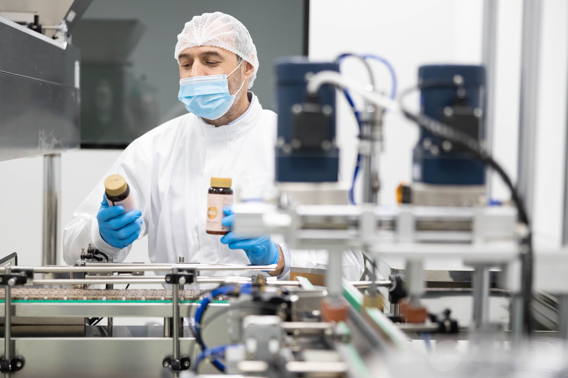 Worker in Clean Room with Supplements
