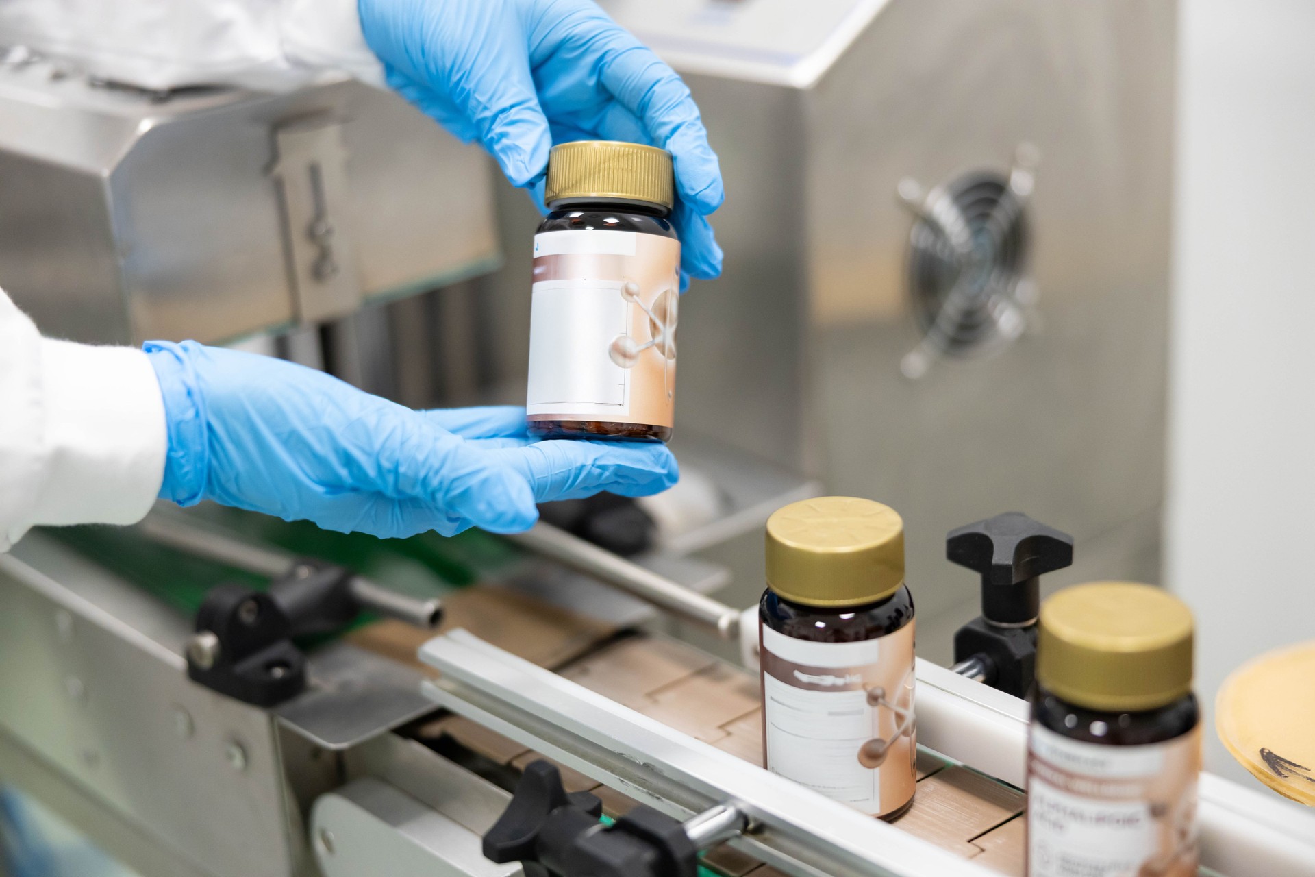Person holding dietary supplement bottle