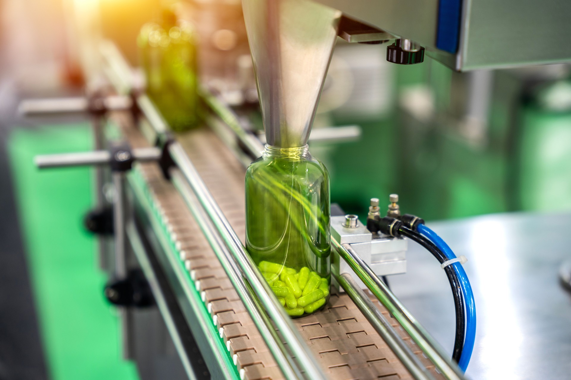 Tablet, Capsule counting machine conveyor in production line of pharmaceutical industry.